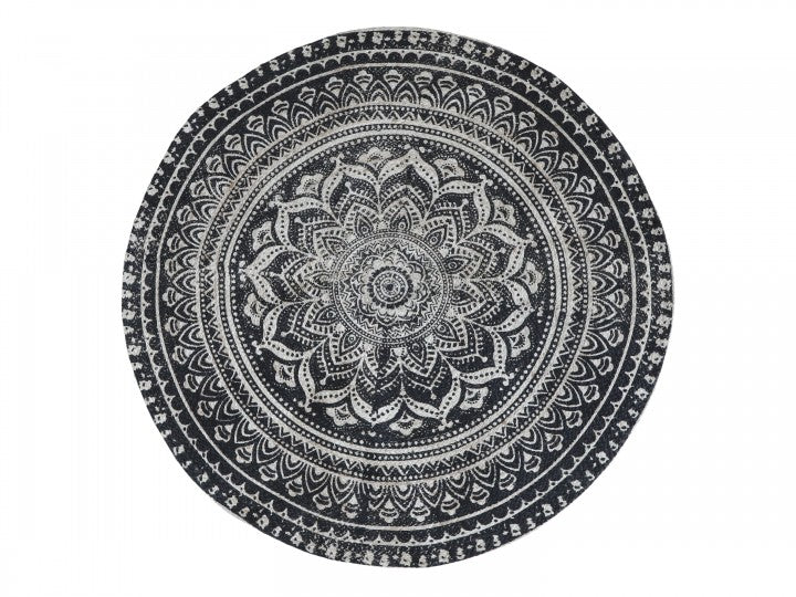 Round black and natural rug