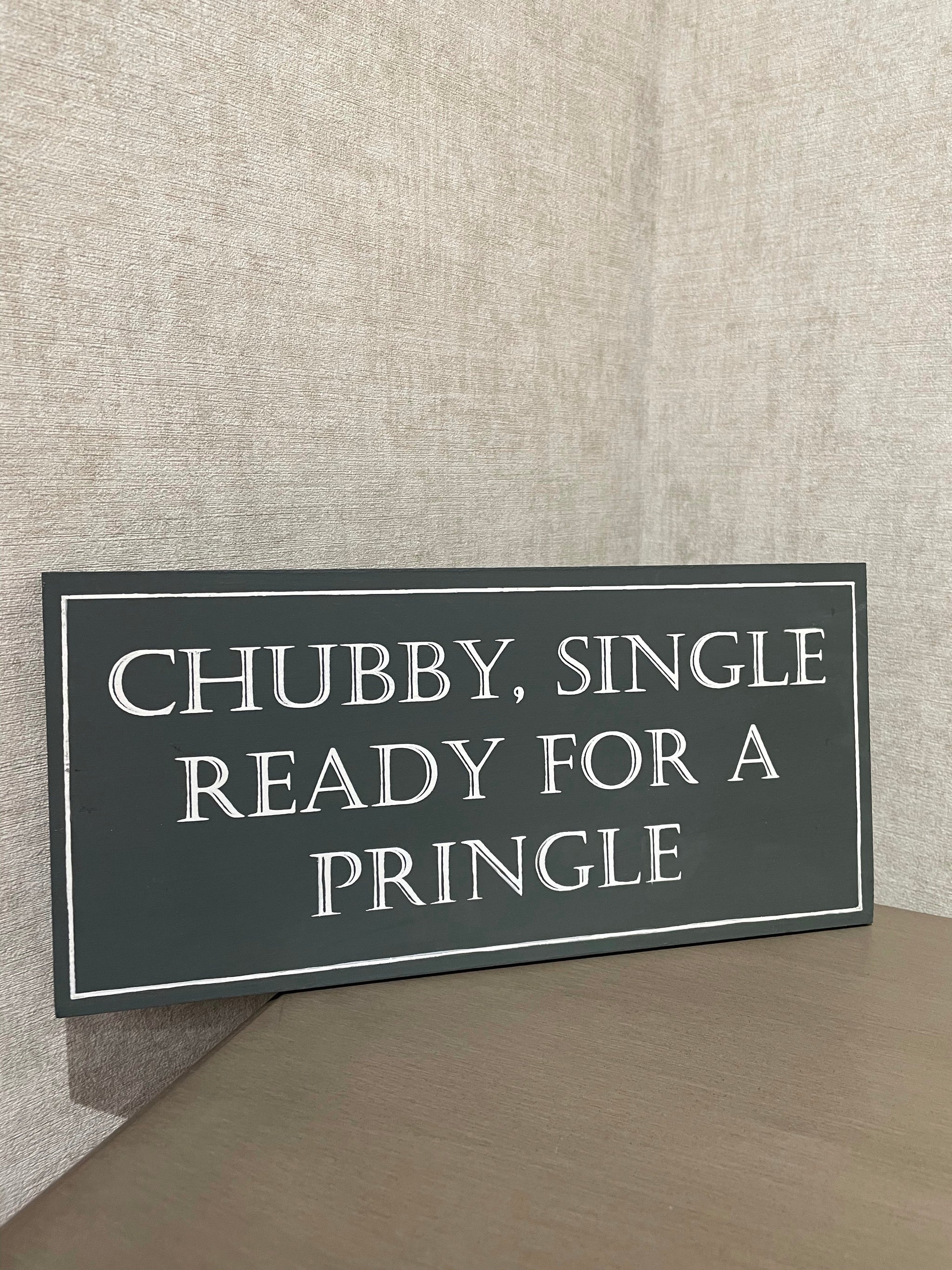 Chubby , Single & Ready for a Pringle sign